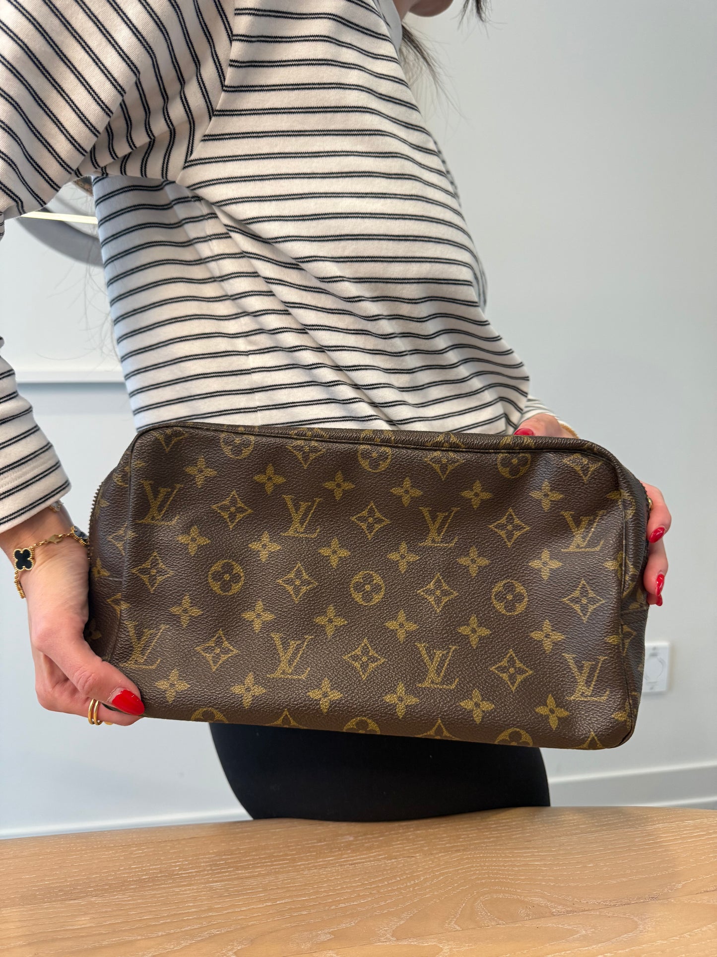 Louis Vuitton monogram trousse Gm classic clutch in pristine condition inside and out ! Fits phones keys makeup water bottles