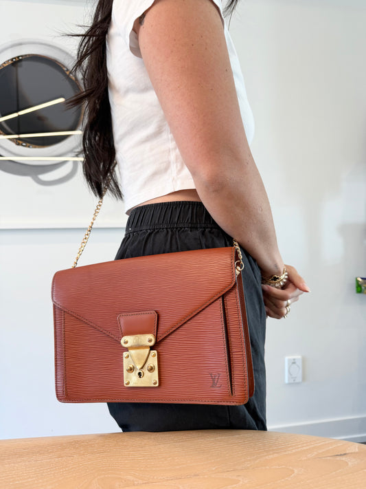 Louis Vuitton epi dragonne with original keys original wristlet and added strap! Fits wallets phones makeup lipstick keys etc orangeybrown colour !