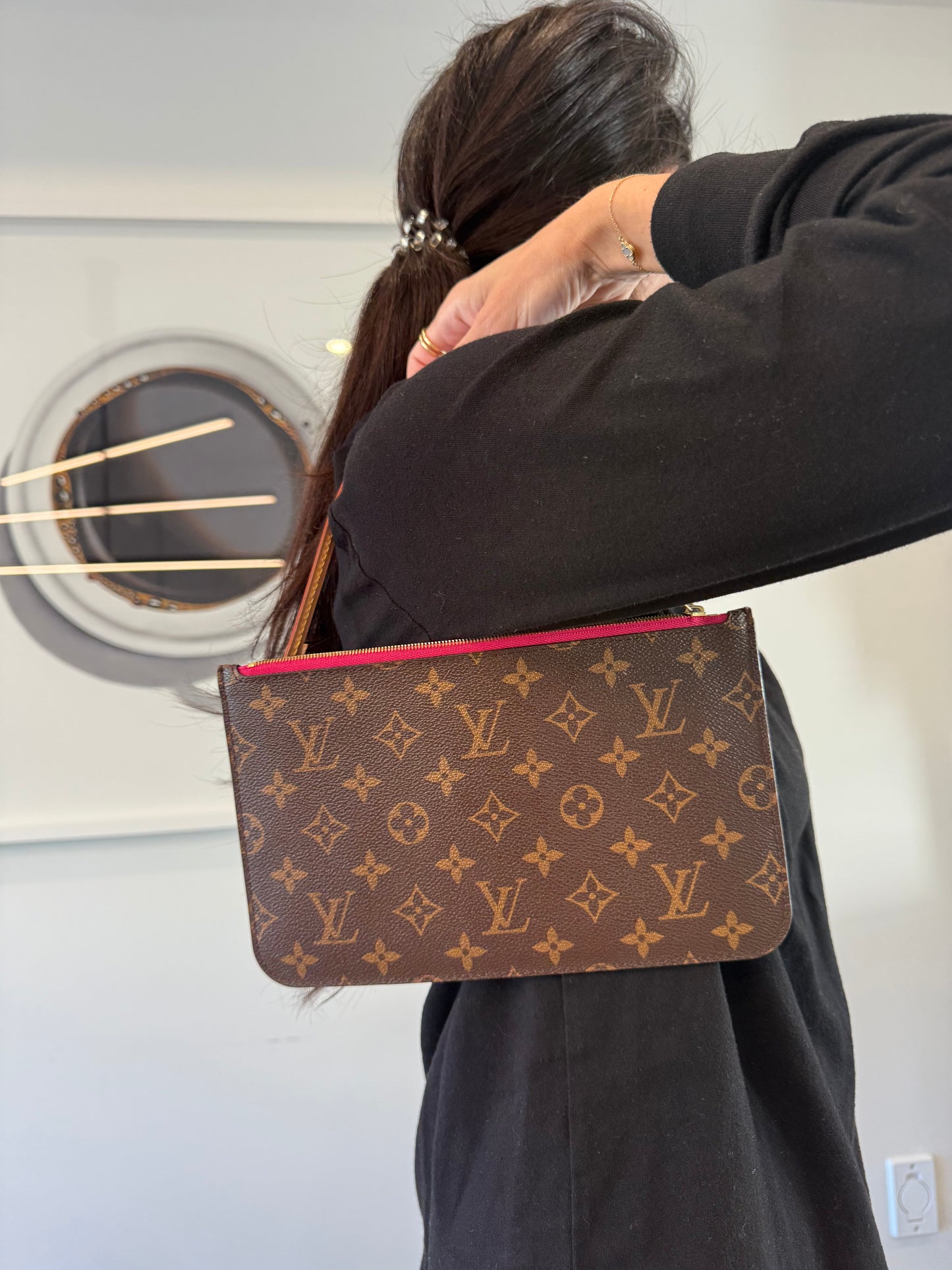 Louis Vuitton monogram GM Pochette wristlet with Fuschia interior in like brand new condition inside and out ! Fits phones keys makeup cards etc