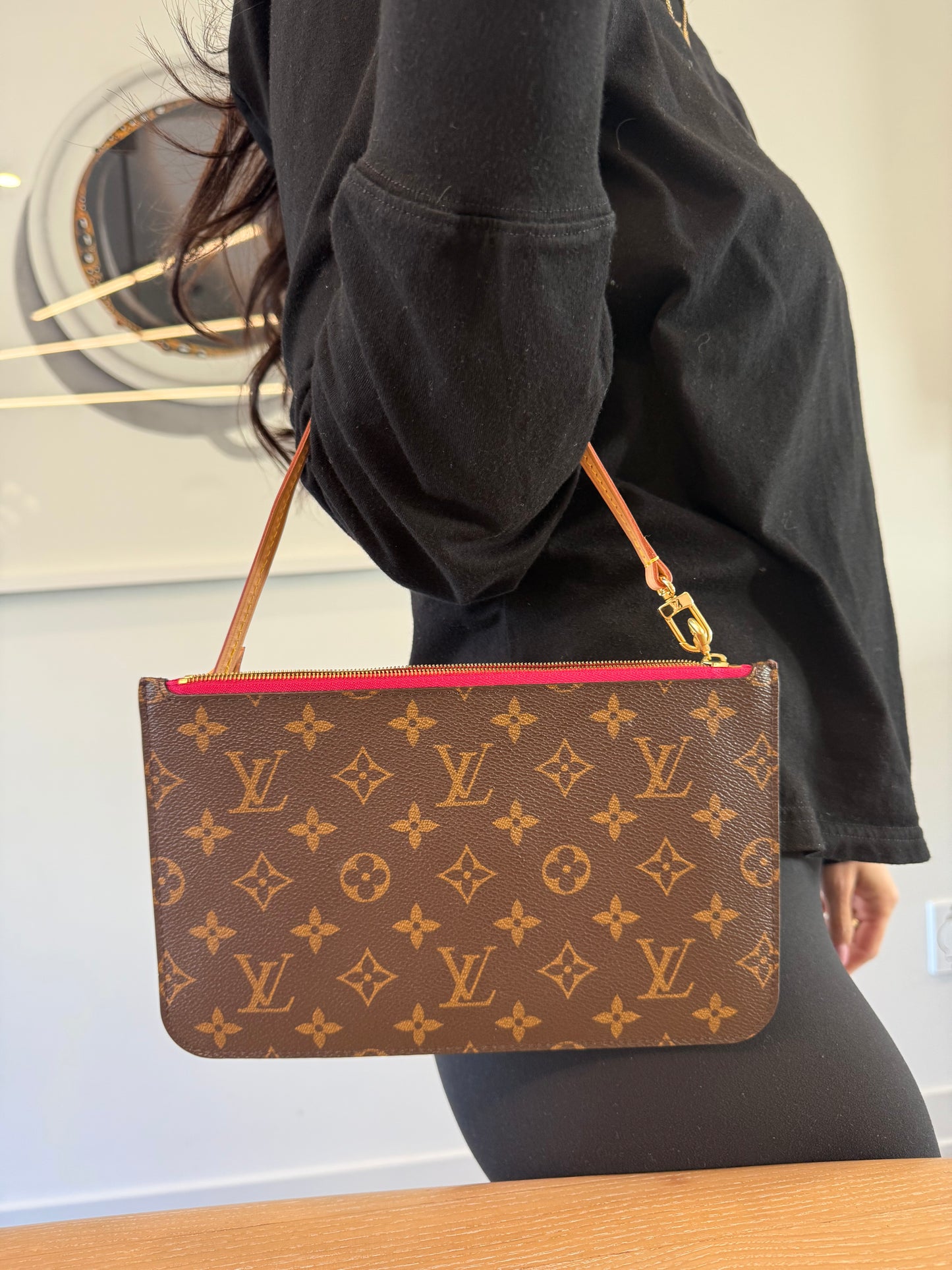 Louis Vuitton monogram GM Pochette wristlet with Fuschia interior in like brand new condition inside and out ! Fits phones keys makeup cards etc