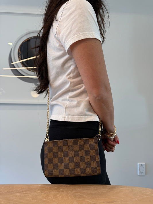 Brand new Louis Vuitton Damier Ebene Coametic crossbody clutch with added strap and red interior fits phones keys makeup cards etc