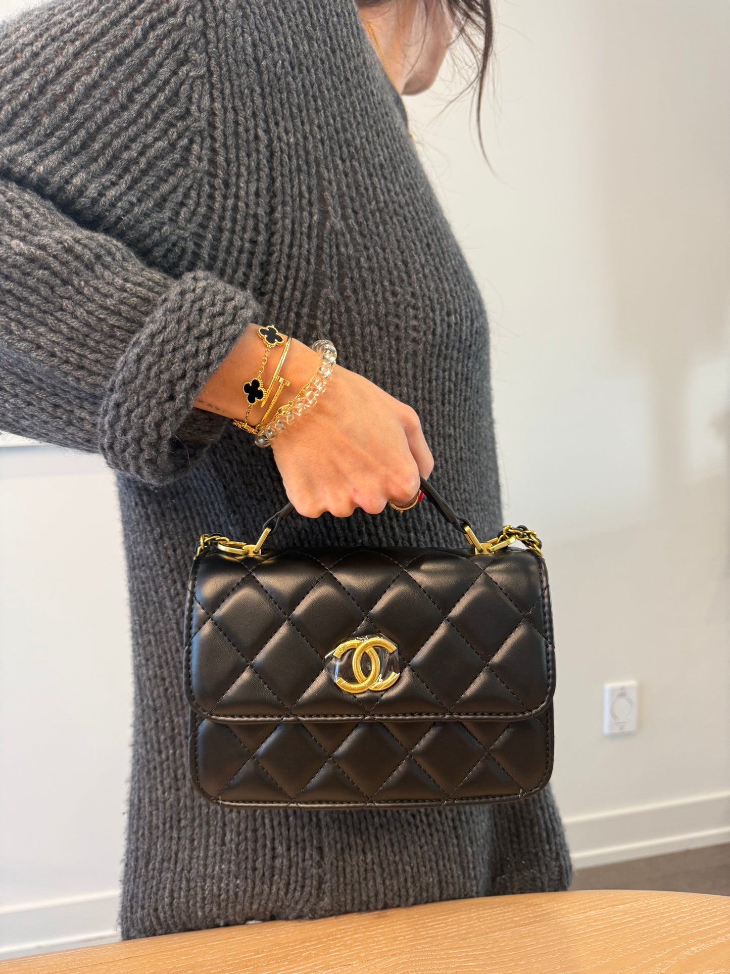 Brand new in box ! Rare Chanel makeup top handle black/gold quilted crossbody bag with adjustable strap! Fits phones keys wallets etc ! This is not a $15,000 bag this is a makeup line piece !