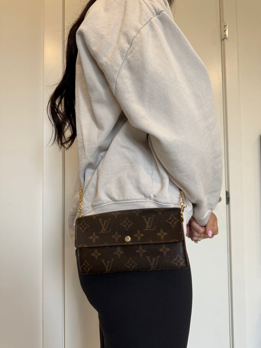 Louis Vuitton monogram Sarah wallet with added strap and original box fits phones ! Selling cheap !