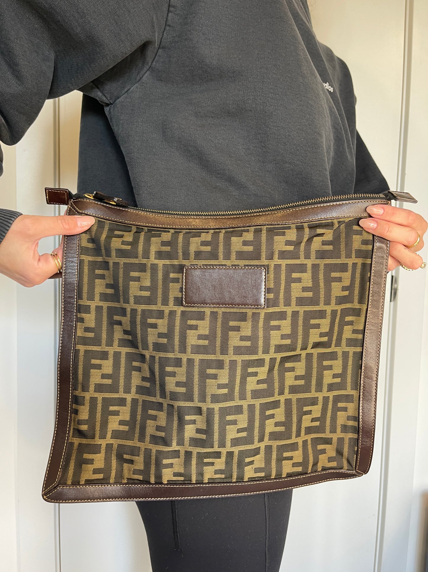 Fendi Zucchino zipper top clutch in pristine condition