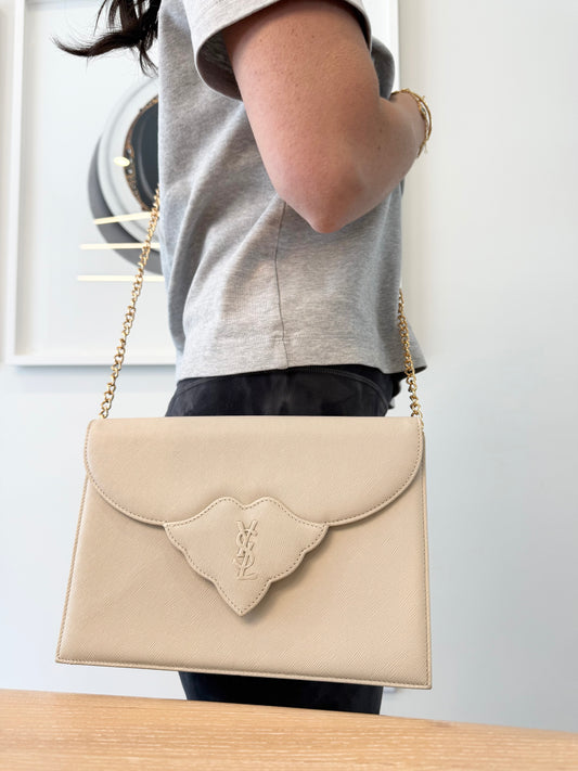Authentic Yves Saint Laurent Ivory crossbody clutch with added removeable strap with stickers on in like new condition inside and out !