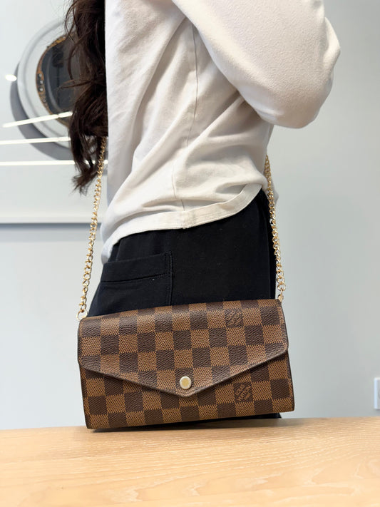 Authentic Louis Vuitton damier ebene Sarah wallet with added removeable strap fits phones etc retail $936 plus tax