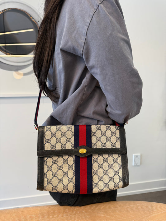 Gucci supreme blue web crossbody clutch with added matching adjustable strap fabric interior fits phones wallets keys makeup etc