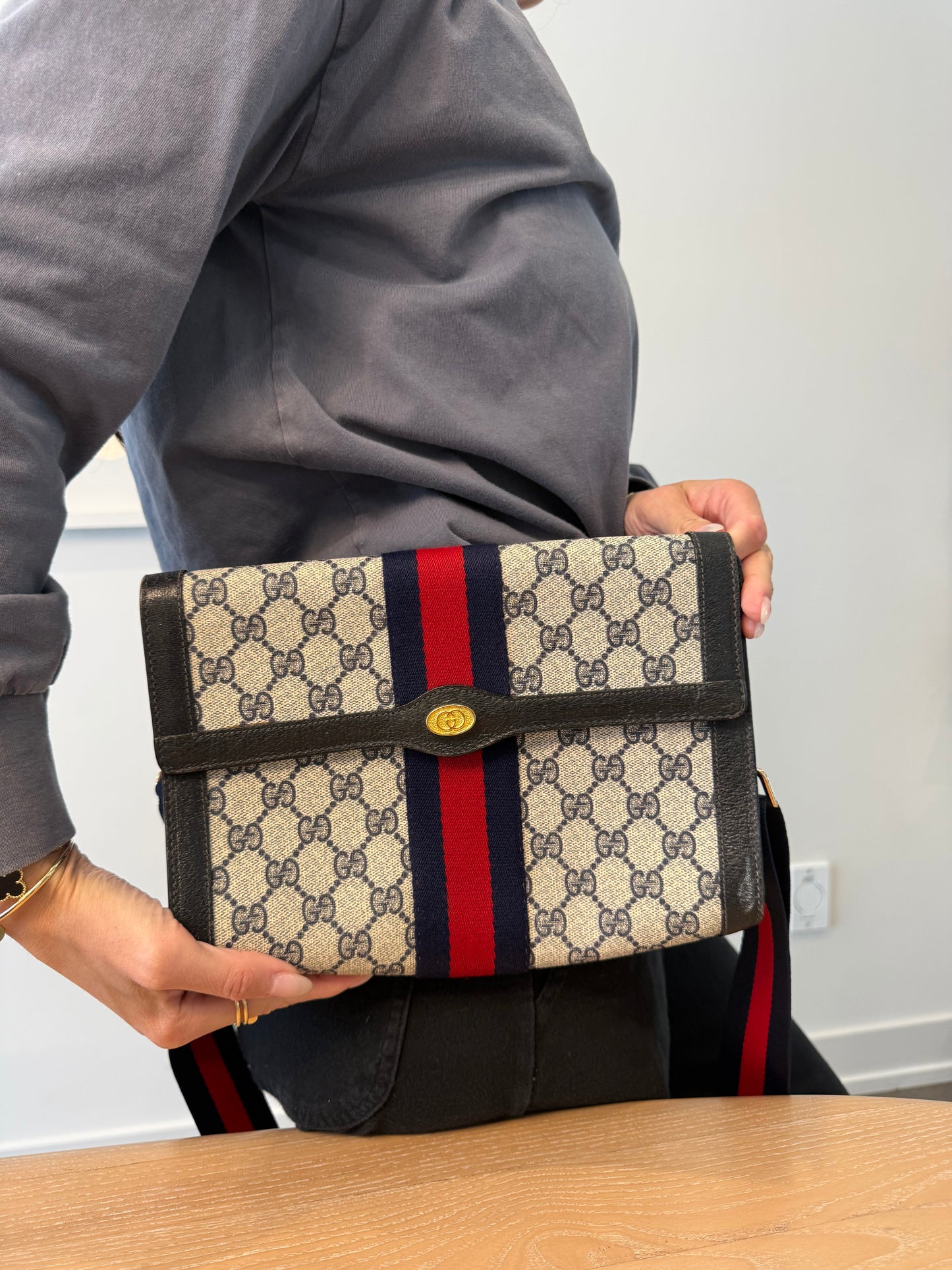 Gucci supreme blue web crossbody clutch with added matching adjustable strap fabric interior fits phones wallets keys makeup etc