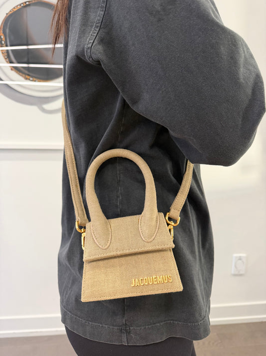 Authentic Jacquemus Le Chiquito leather mini bag in tan in dustbag with removeable original adjustable strap client paid $1600 plus tax fits cardholders and lipstick , keys . Perfect evening bag