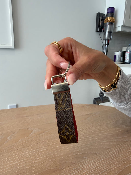 Upcycled lv keychain with silver hardware at made from an authentic keepall 60