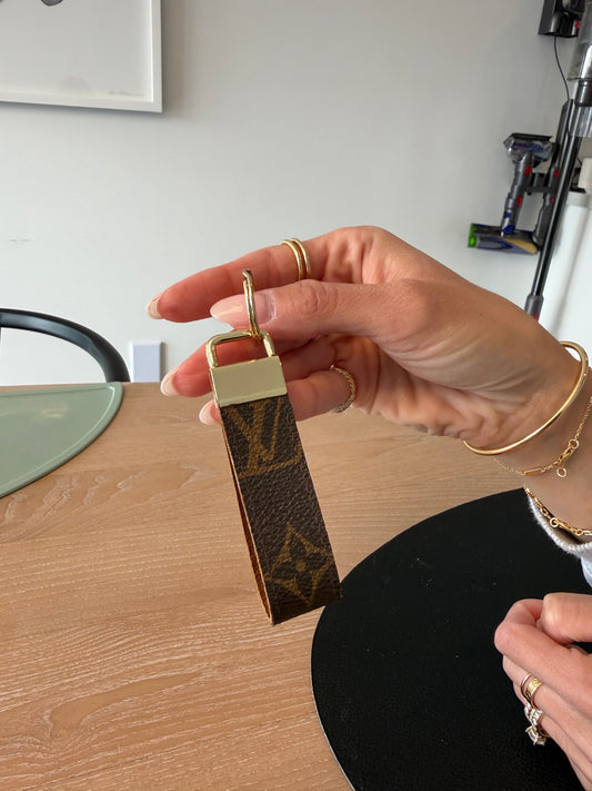 Upcycled 100% authentic keychain with brown tan interior made from a keepall 60