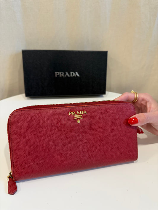 Retail $1290 Prada saffiano red/gold zip around wallet in great condition