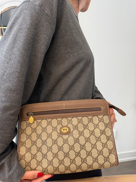 Authentic Gucci unisex supreme Classic brown zipper top clutch in absolute pristine preloved condition inside and out !! So clean!