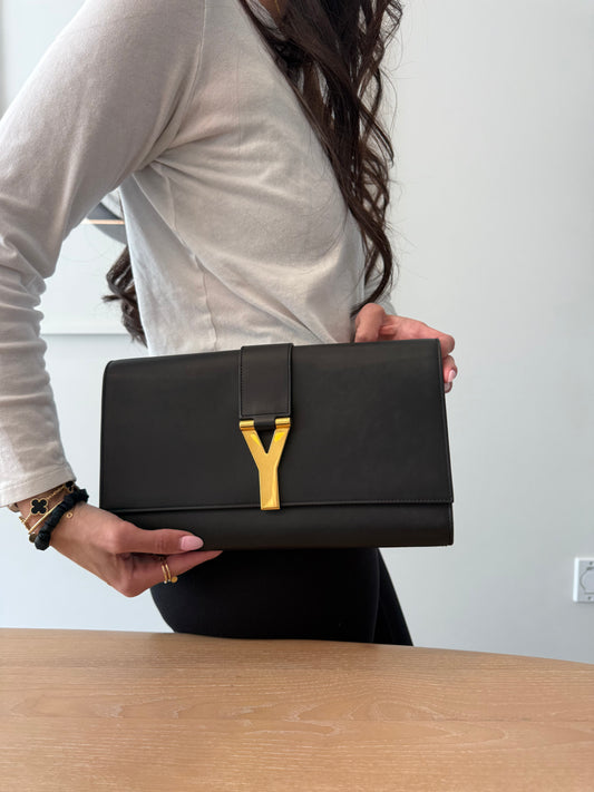 Authentic Yves Saint Laurent Black/Gold suede interior in dustbag pristine condition Evening Y clutch !  Fits makeup phones wallets etc