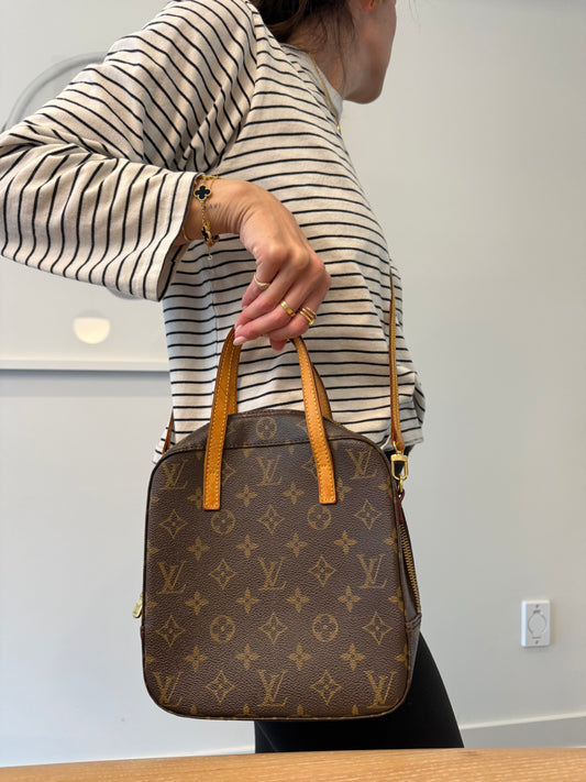 Authentic Louis Vuitton Monogram Spontini 2 Way with original Strap ! Gorgeous preloved condition inside and out ! Fits phones water bottles water bottles makeup etc
