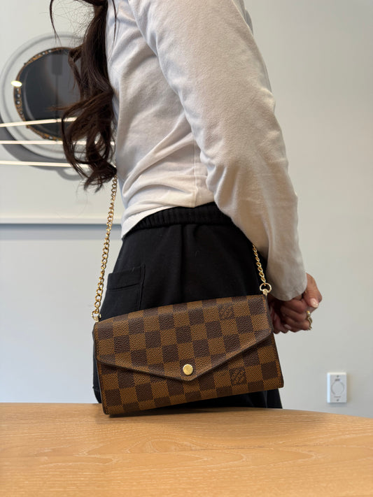 Authentic Louis Vuitton Damier Ebene Sarah wallet with added removeable strap ! Fits all phones cards cash coins etc retail $910