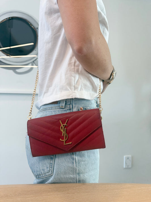 Authentic Yves Saint Laurent Cassandra red/gold wallet with added removable strap retail $1500 fits phones keys cards cash coins etc