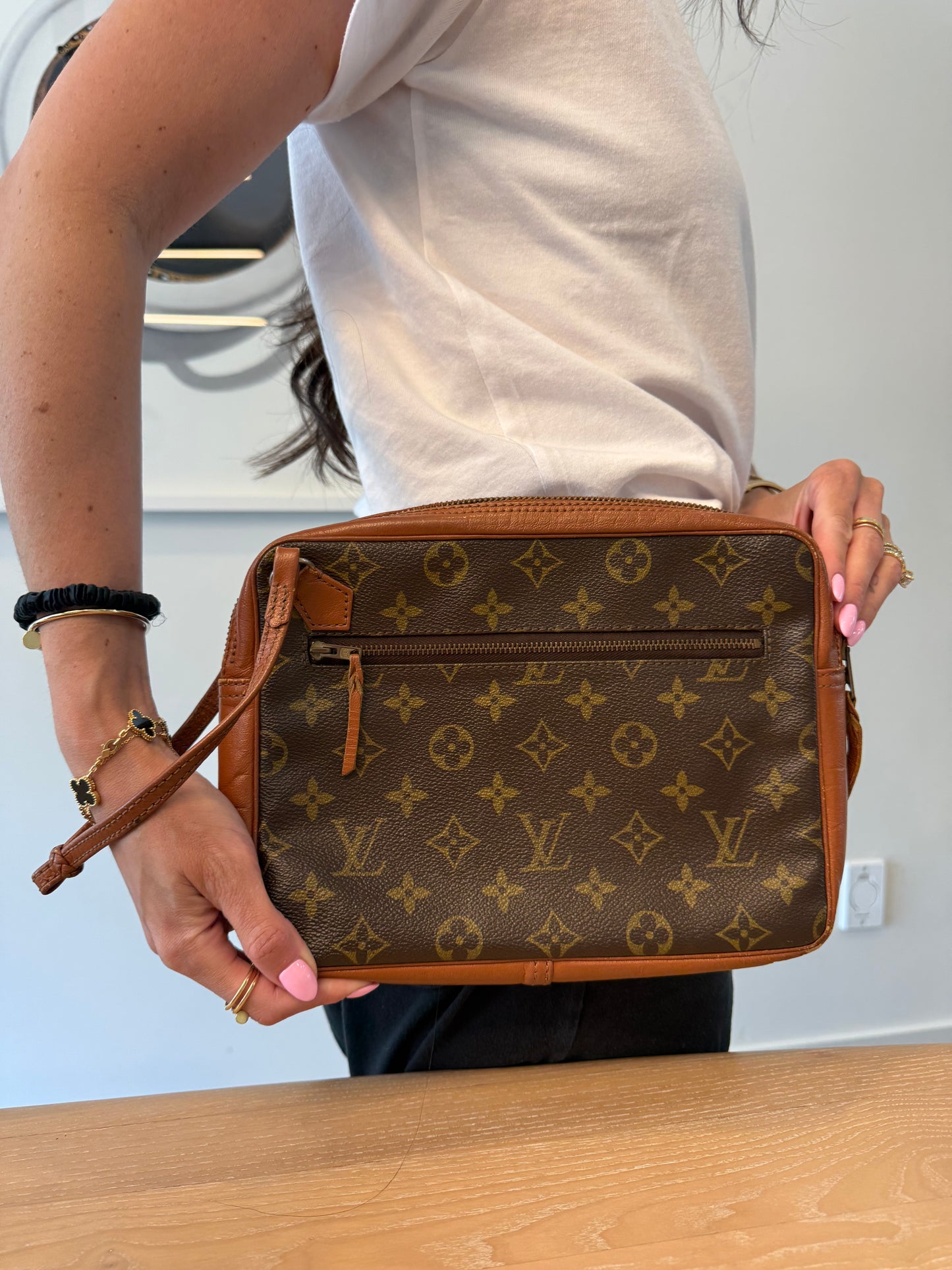 Authentic Louis Vuitton Sac Monogram Wristlet in absolutely gorgeous condition inside and out !All pockets clean! Phones wallets keys makeup etc