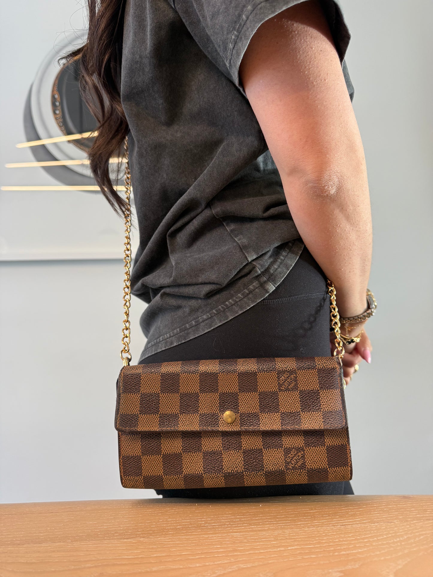 Authentic Louis Vuitton damier ebene Sarah wallet with added removeable strap fits phones cards cash coins etc