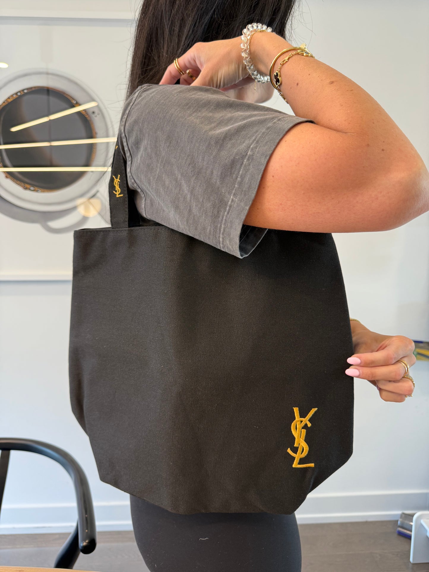 Brand new condition Yves Saint Laurent Parfum black shoppers tote. Laptops phones gym clothes water bottles etc fit