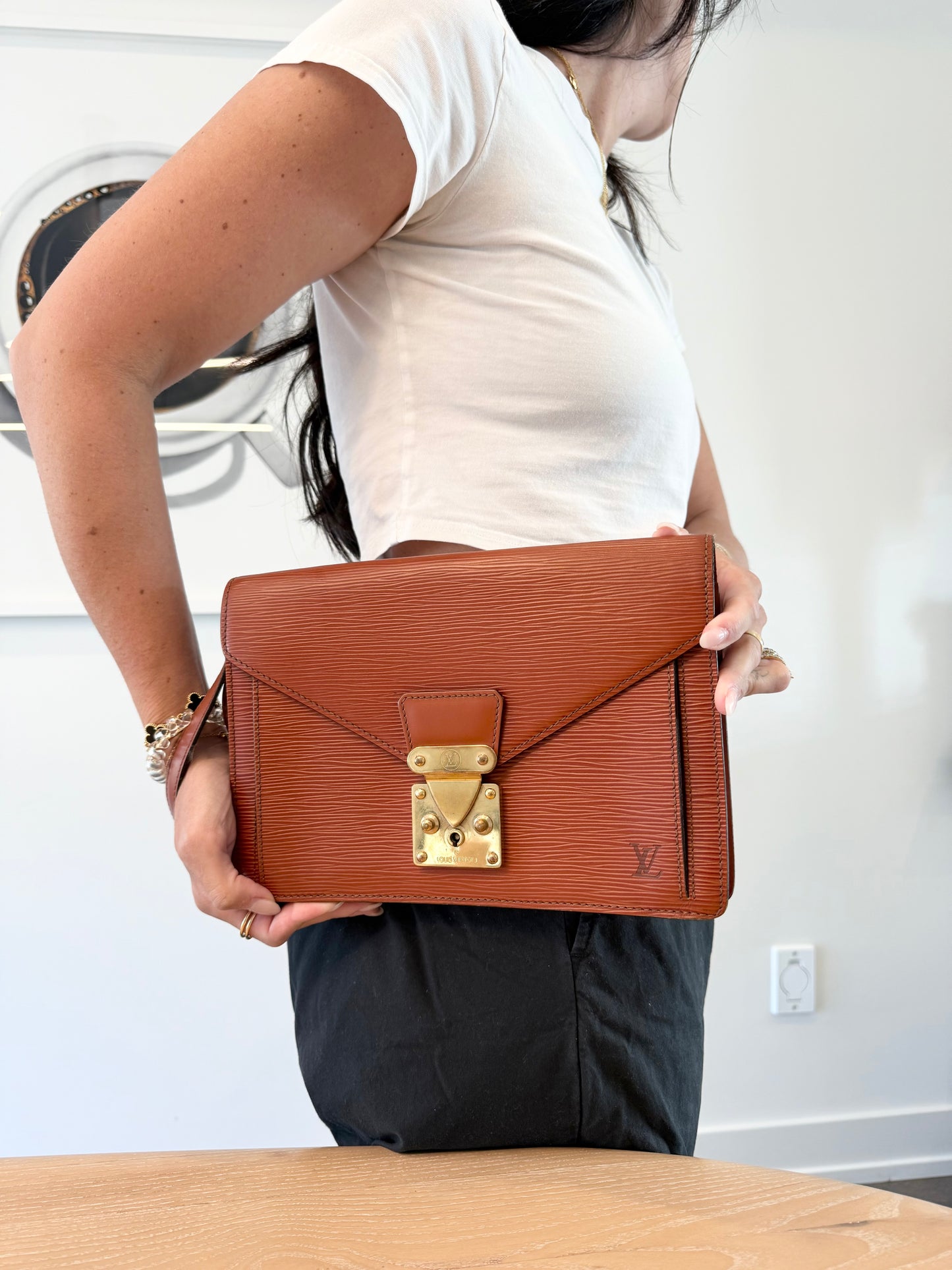 Louis Vuitton epi dragonne with original keys original wristlet and added strap! Fits wallets phones makeup lipstick keys etc orangeybrown colour !