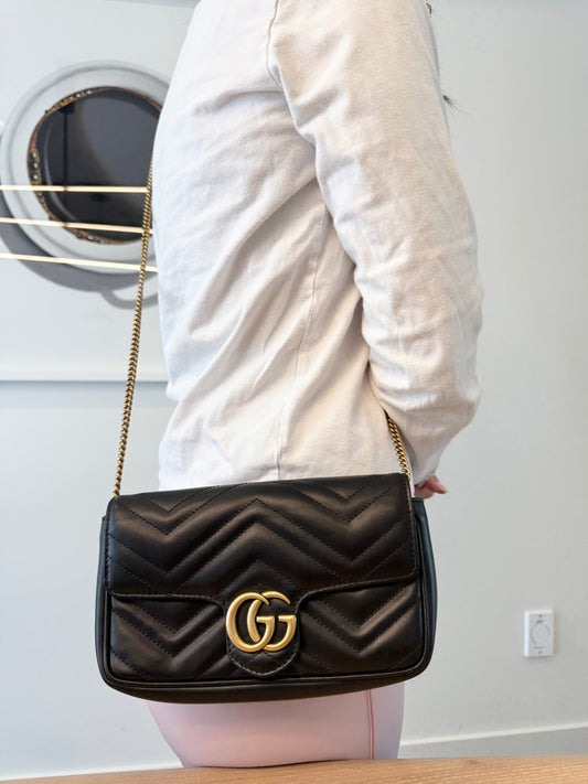 Authentic Gucci Marmont Black and gold Small Crossbody bag in like new condition inside and out in dustbag! Client paid over $3000!! Asking 50% off fits phones keys wallets etc