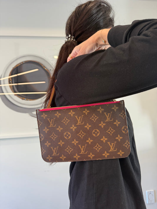Louis Vuitton monogram GM Pochette wristlet with Fuschia interior in like brand new condition inside and out ! Fits phones keys makeup cards etc