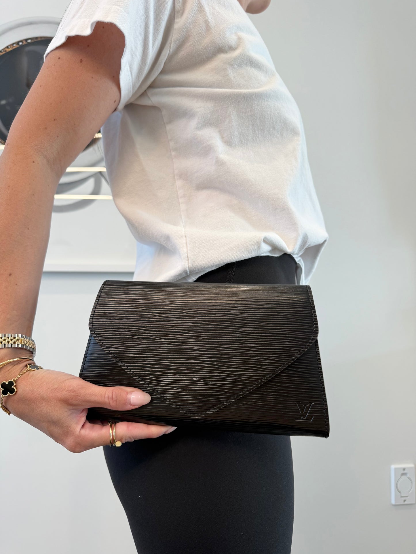 Authentic Louis Vuitton Epi Black Arts Deco clutch in gorgeous preloved condition
