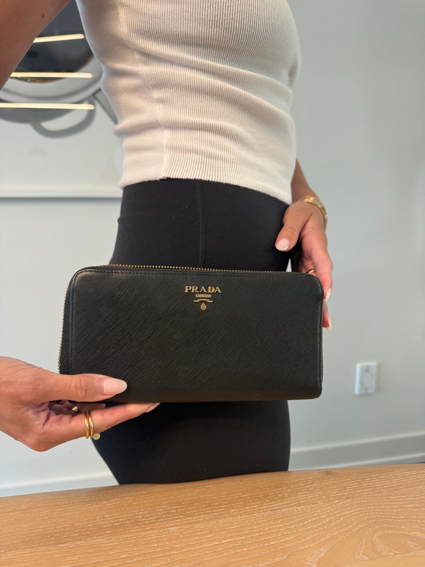 Authentic Prada saffiano zip around wallet retail $1500 zip around doesn’t work other then that clean!