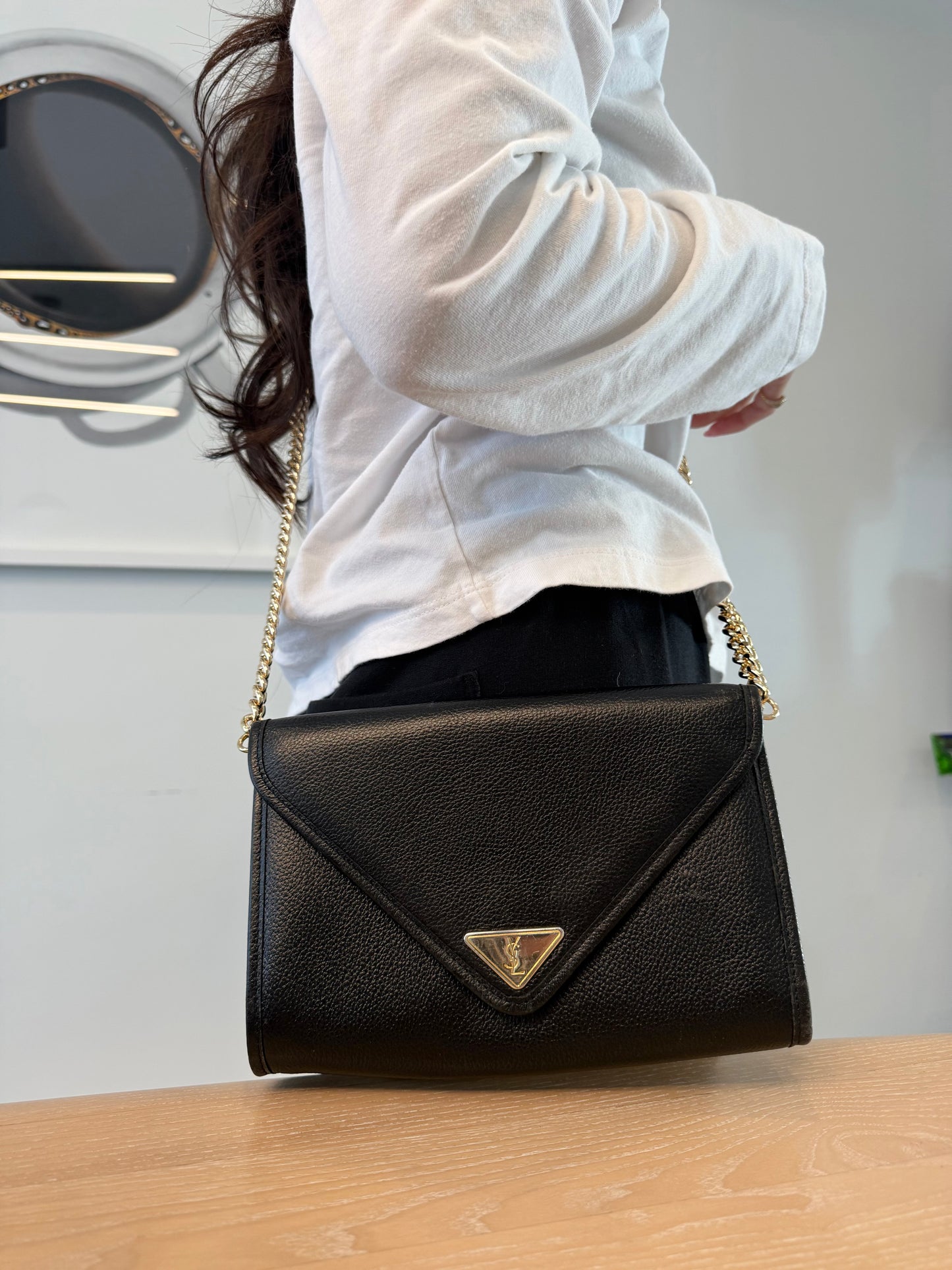 Authentic Yves Saint Laurent magnetic closure black on black crossbody clutch with added strap in gorgeous condition!