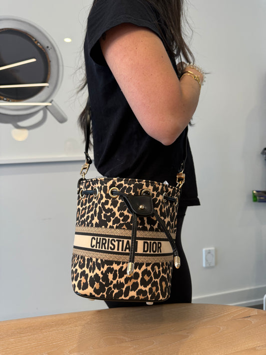 Like new Christian Dior leopard Beatuty bucket shoulder crossbody bag in 9.5/10 condition fits phones wallets keys makeup etc such a rare drawstring