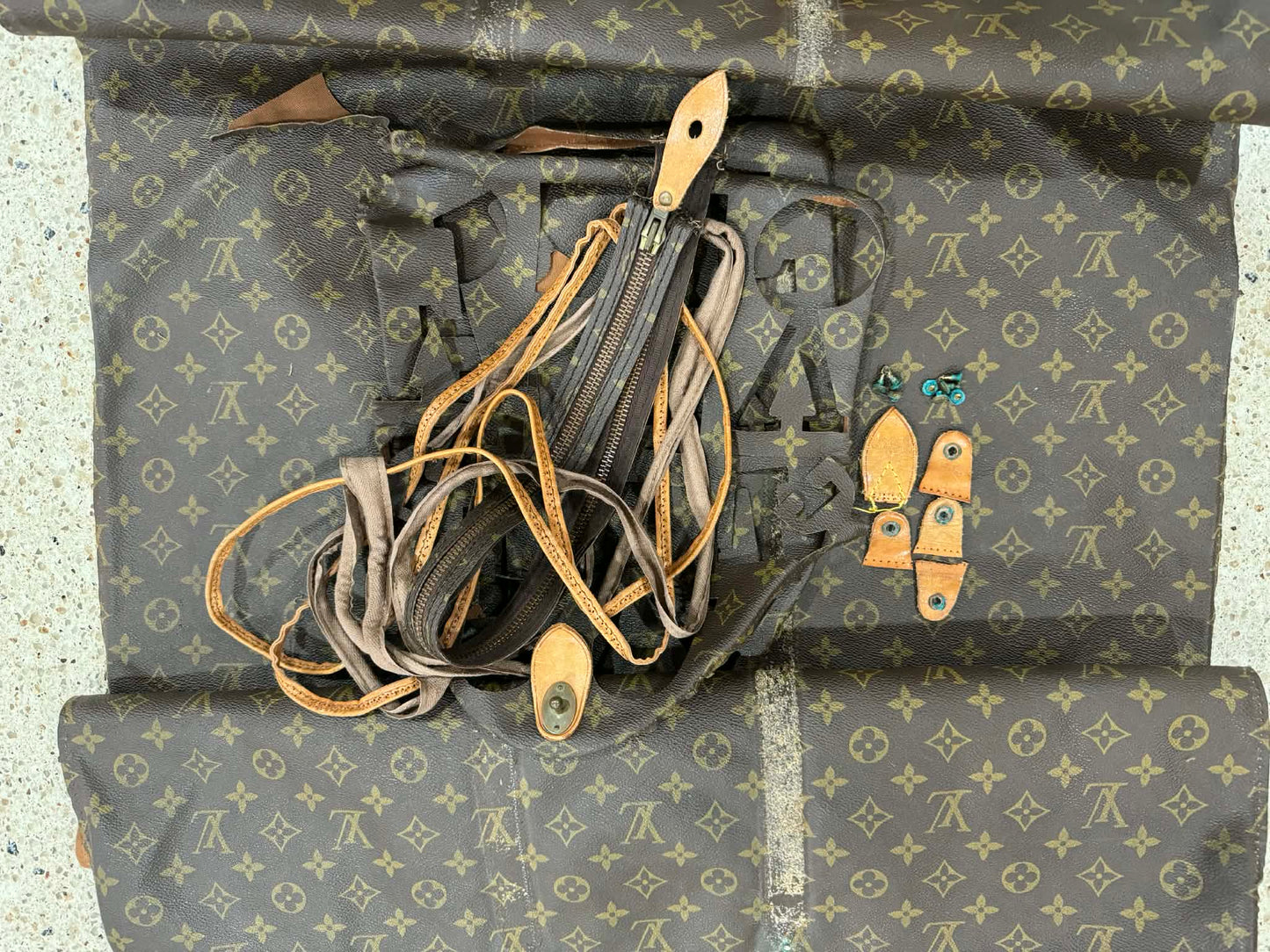 Upcycled 100% authentic keychain with brown tan interior made from a keepall 60